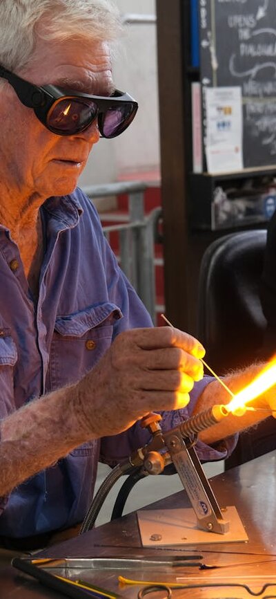 Intro to beadmaking at Canberra Glassworks Participants learning beadmaking