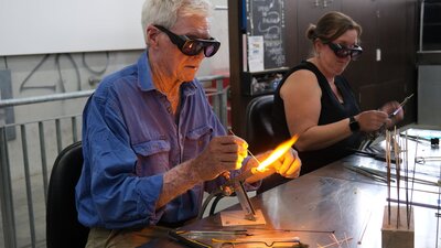 Intro to beadmaking at Canberra Glassworks Participants learning beadmaking