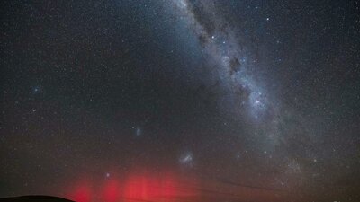 Two galaxies, the Milky Way near the Southern Cross and the red of the Aurora It is fun to capture as much as the Milky Way and Southern cross when taking photos of the aurora