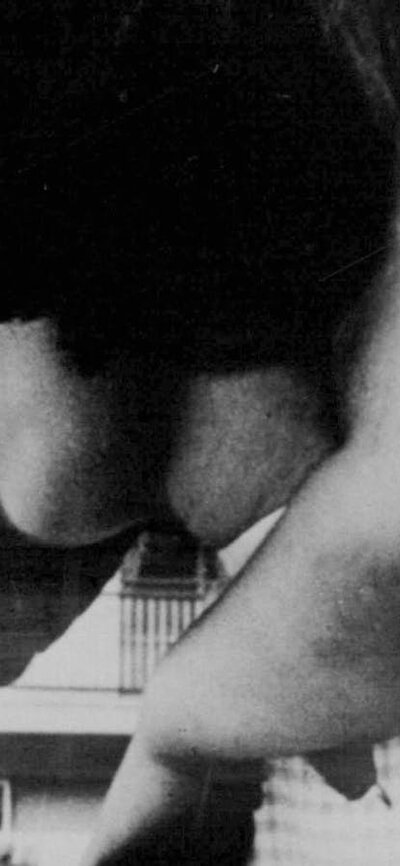 Black and white image of a woman holding a child