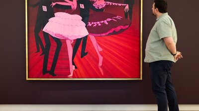 Visitor at the National Portrait Gallery, featuring John Brack's Latin American Grand Final 1969 A person views a large painted portrait depicting people dancing, hanging on a gallery wall