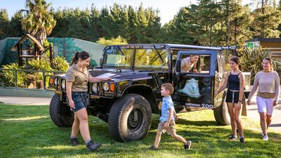 The Hummer - one of the vehicles you can choose for our Wild Night ZooVenture Tours Family and zoo guide with a Hummer, a vehicle used for night tours within the national zoo