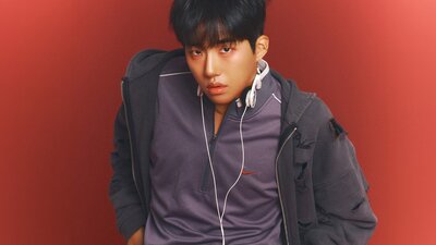 Photo of KINKY with a red background