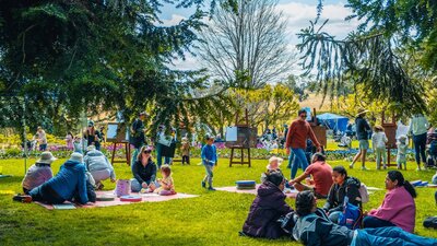 Families enjoying the Lanyon Homestead lawns at Kids Day Out