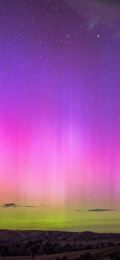 The yellows pinks and purple of a strong display of the Aurora Australis