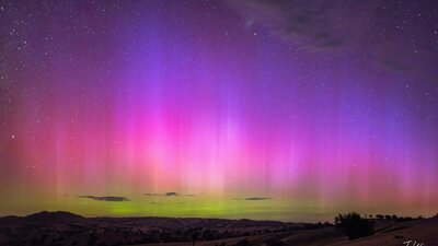 The yellows pinks and purple of a strong display of the Aurora Australis