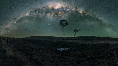 A typical rural scene in country near Canberra with setting arch of the Milky Way