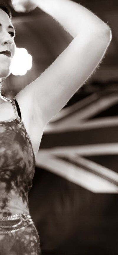 Female vocalist with Australian flag in background