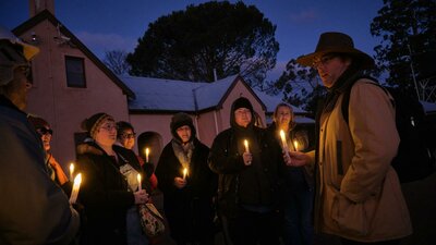 Tim the Yowie Man explaining something at Lanyon Homestead at dusk