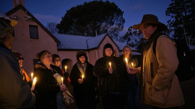 Tim the Yowie Man explaining something at Lanyon Homestead at dusk