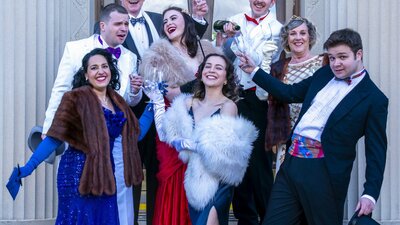 Group of actors in Opera finery