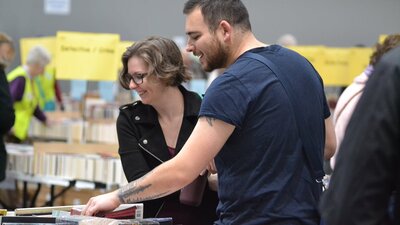 Two people enjoying the Lifeline Bookfair