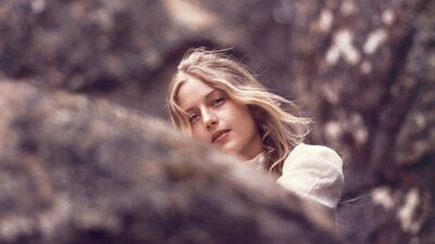 Picnic at Hanging Rock (1975) woman looking past camera, image from film of picnic at hanging rock