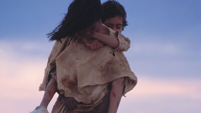 Rabbit-Proof Fence (2002) One young person piggy backs a younger person in a desolate setting