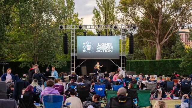 Crowd sitting in front of screen for Lights! Canberra! Action!