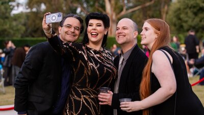Group of people smiling to camera together