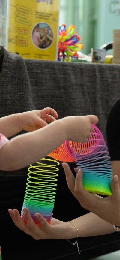 Child interacting with Questacon staff at Little Explorers' Days