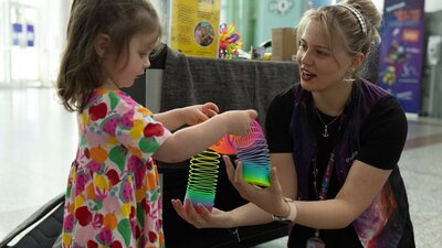 Child interacting with Questacon staff at Little Explorers' Days