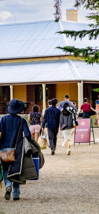 Crowd walking in Lanyon Homestead gates
