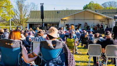 People watching CSO perform at Live at Lanyon with large picnicking crowd