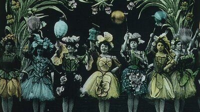 Vintage looking image of several women in a row dressed up in fancy dresses