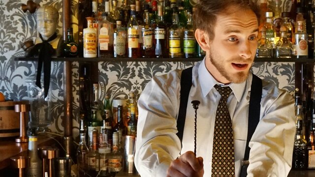 Love & Forgeting Man at a bar, making a drink
