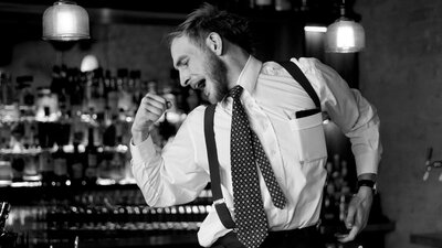 Man at a bar dancing
