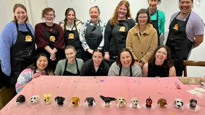Workshop participant with finished scuptures