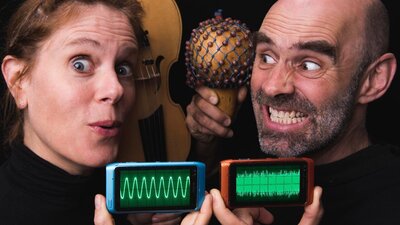 Photo of the artist, Kylie Morrigan and Mal Webb People holding percussion instruments and sound wave machines