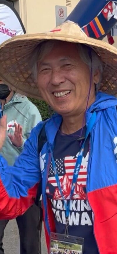 Taiwanese man waving at the start