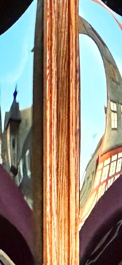 A distorted reflected city.