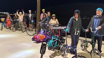 Fun times on our bike parties around Lake Burley Griffin People and bikes line up beside Lake Burley Griffin during a bike party.