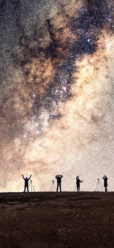 YMCA pose under the Milky Way Group photo under the stars