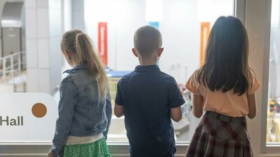 children overlooking the factory at the Mint