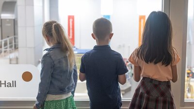 children overlooking the factory at the Mint