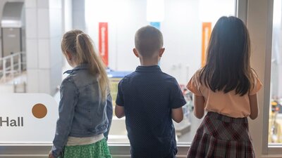Kids overlooking the factory at the Mint