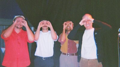 Four artists standing next to each other