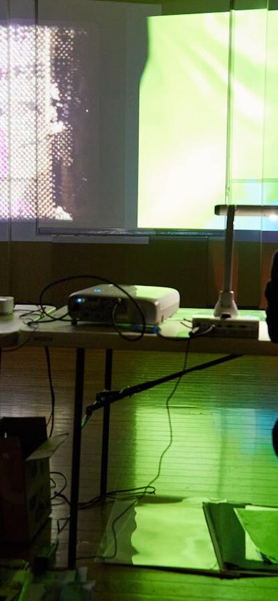 musician in from of colourful background