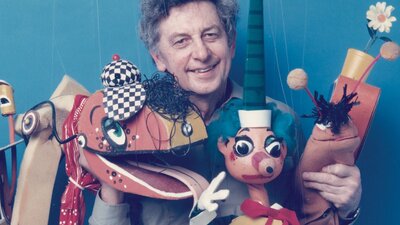 Norman Hetherington with Bill Steamshovel, Mr Squiggle and Gus the Snail Norman Hetherington with puppets Bill Steamshovel, Mr Squiggle and Gus the Snail