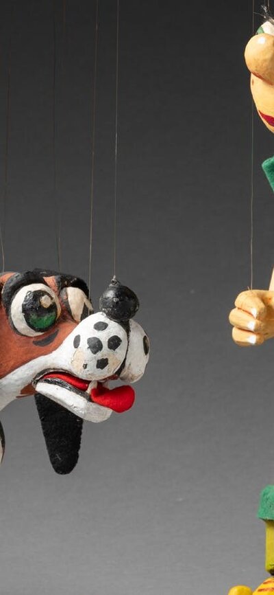 'Nicky' puppet A string puppet of a boy with orange hair and a dog.