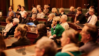 A group of people in the House of Representative chambers