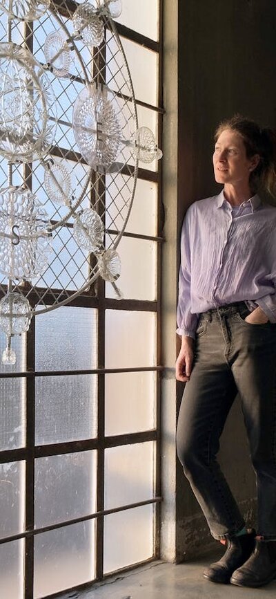 Designer standing in Glassworks heritage stairwell