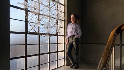 Designer standing in Glassworks heritage stairwell