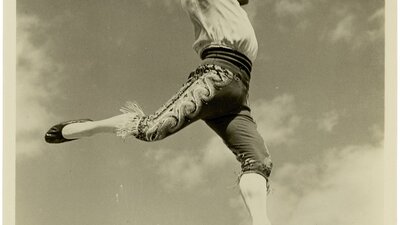 The Colleano Heart + Q&A, 05 July, 2026 Black and white image of a man walking on a tightrope smiling