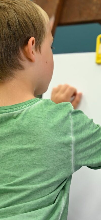 Child painting at Canberra Museum + Gallery