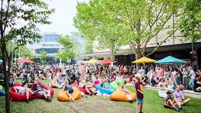 Chill out while watching a cooking demo or cultural performance A crowd of people in Garema place