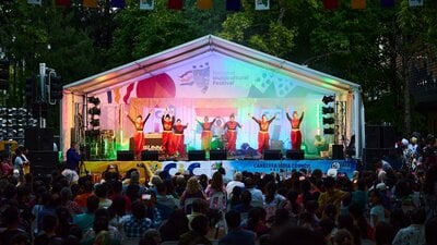 A group of women dancing on stage at the festival