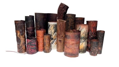 Melinda Young | Vessels Landscape 2026 A collection of earthen coloured metal vessels against a white background