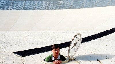 Man coming out from a satellite trap door