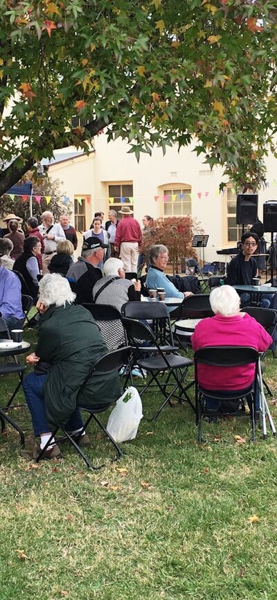 Entertainment at Gungahlin Homestead Open Day. People seated outdoors watching choir.